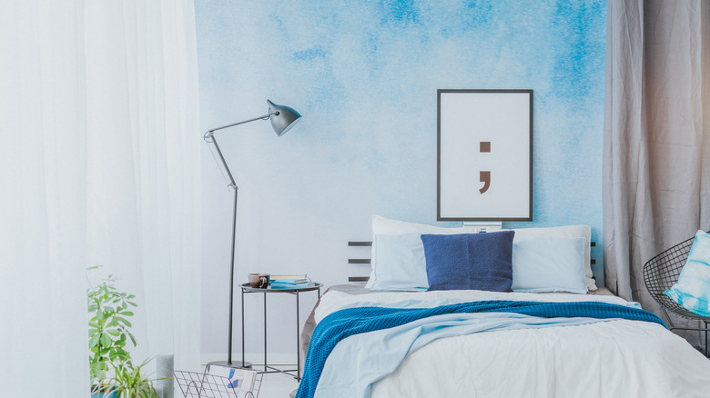 bedroom with watercolor-painted wall