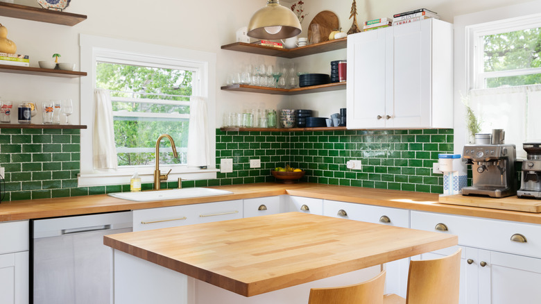 kitchen with green backsplash