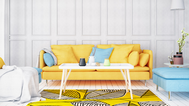 living room with yellow sofa