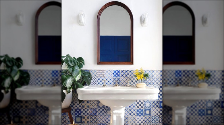 Mediterranean style bathroom with Portuguese tile backsplash behind sink