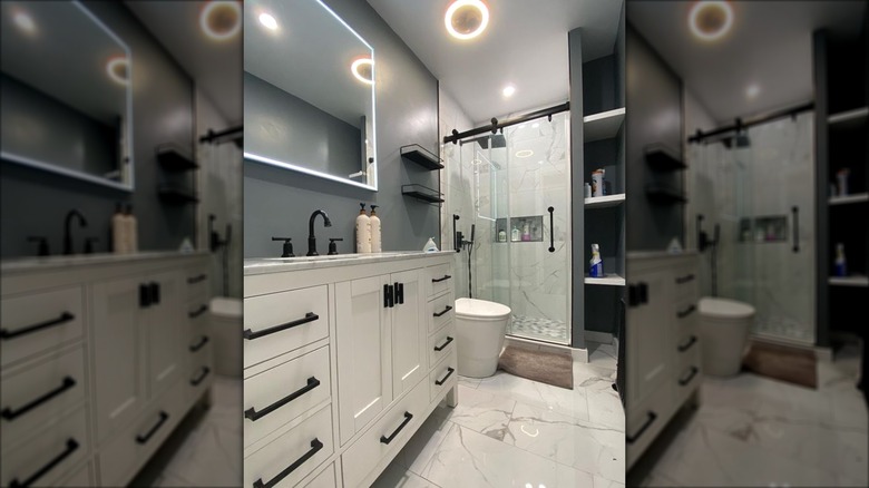 Modern bathroom with marble shower and floor tiles