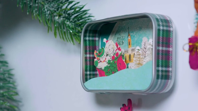 3D magnetic diorama in a tin box showing Christmas scene