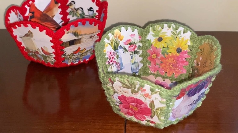 Woven baskets on table made using old greeting cards