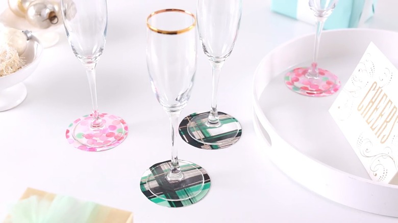 Champagne flutes on DIY coasters on white table