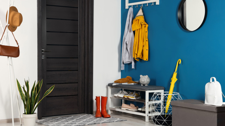 A bold blue entryway to a modern home