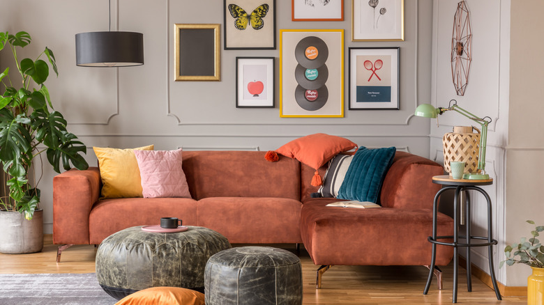 Velvet couch with leather cushions and cotton pillows