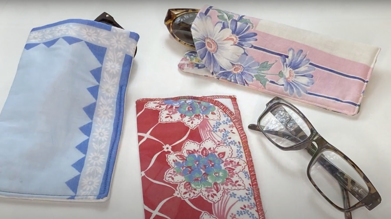 Glasses cases made from vintage hankies and a few pairs of glasses.