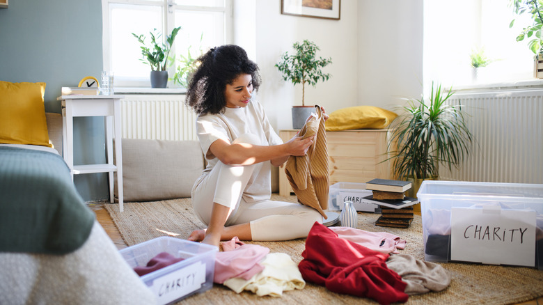 Person decluttering room