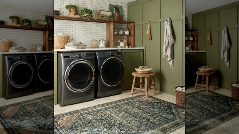 A Joanna Gaines x Loloi rug is on the floor in a laundry room