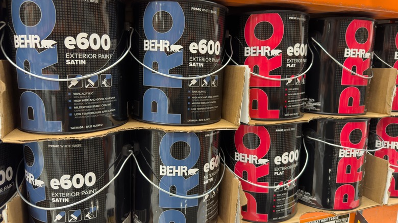 Cans of Behr e600 exterior paint in a store