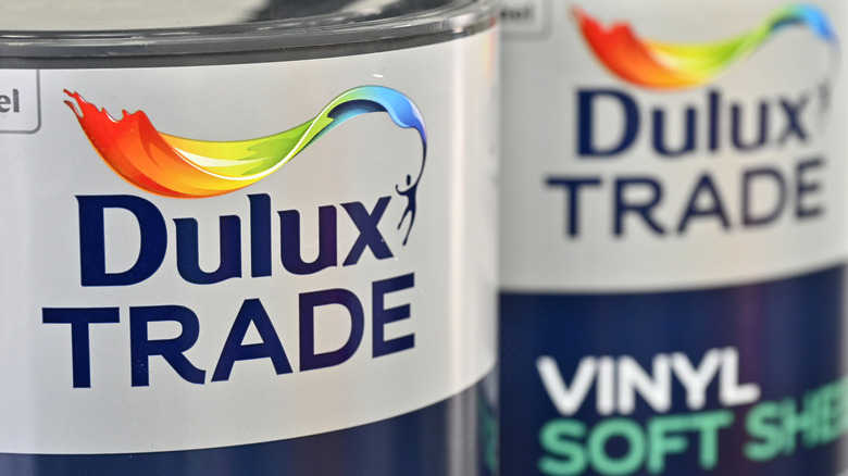 A close up of Dulux Trade paint cans