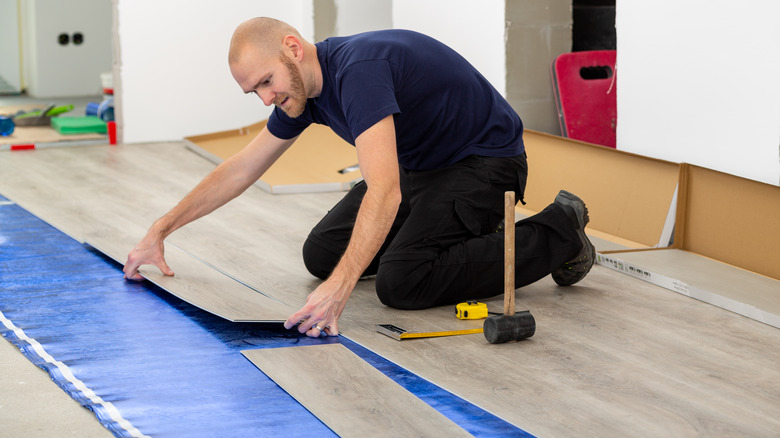 man laying floor over foam