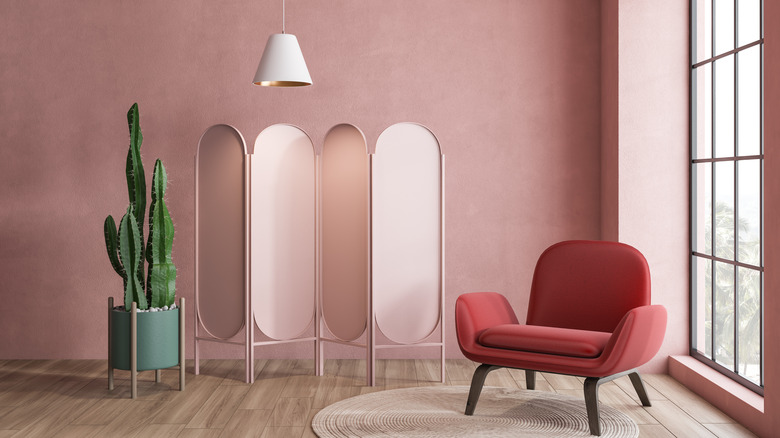 deep millennial pink accent wall with decor