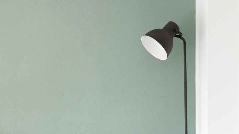 olive green on wall with lamp