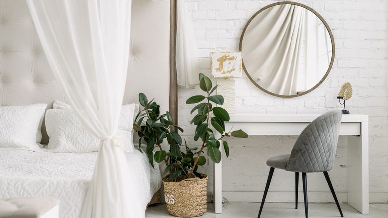 round mirror in a bedroom