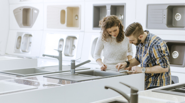 people shopping for kitchen sinks