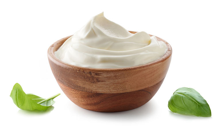 Wooden bowl of yogurt