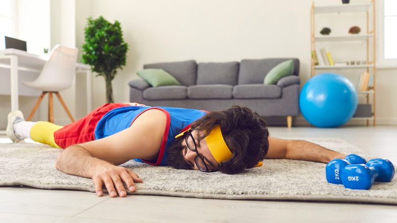 Sportsman lying on a rug