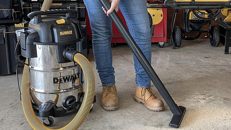 DeWalt wet/dry vacuum in action in a workshop