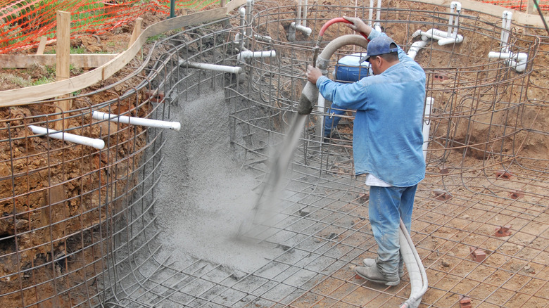 spraying gunite for inground pool