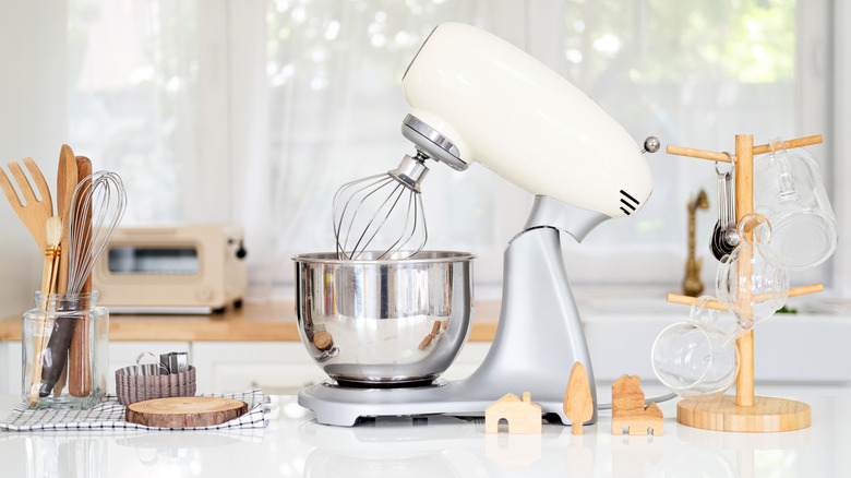 Cream stand mixer with wooden accessories