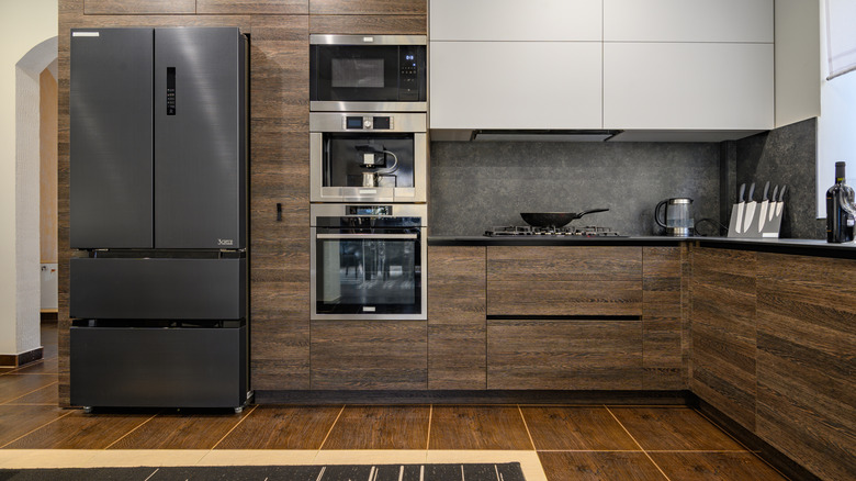 Slate refrigerator in neutral kitchen