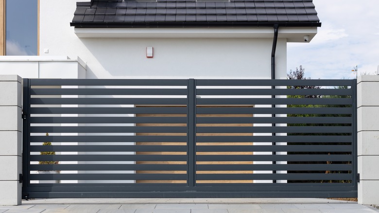 black modern fence in front of house