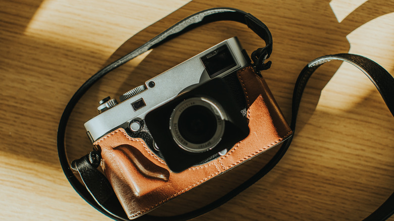 old camera with leather strap