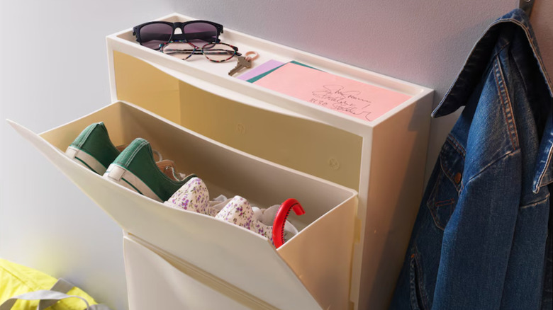 white shoe cabinet with children's shoes