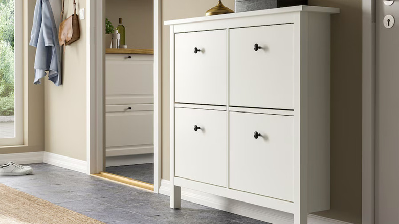 white shoe cabinet with four compartments