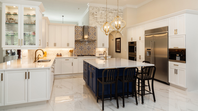 Luxury kitchen with white marble flooring