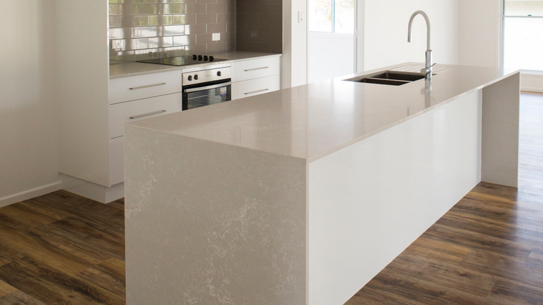 White modern kitchen with luxury vinyl plank floor