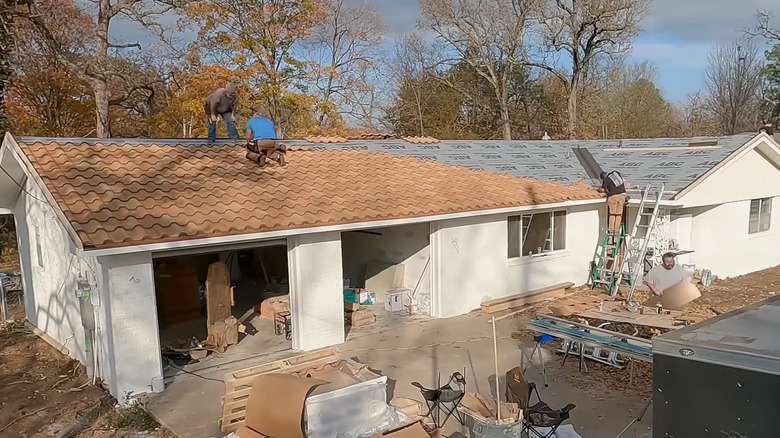 replica clay roof tiles being applied