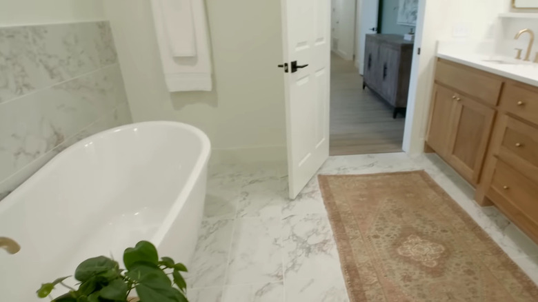 porcelain tile bathroom with freestanding tub