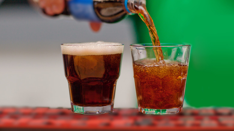 pouring coca cola in glass