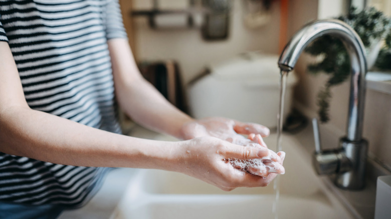 woman washing her hands