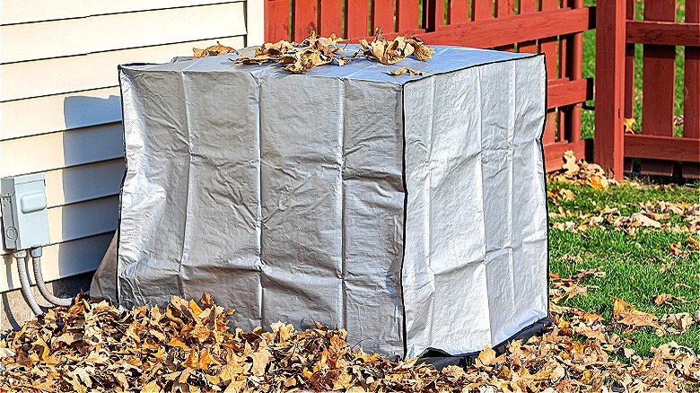 AC condensor covered with tarp