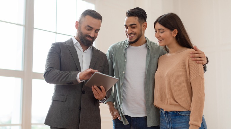 Couple and real estate agent