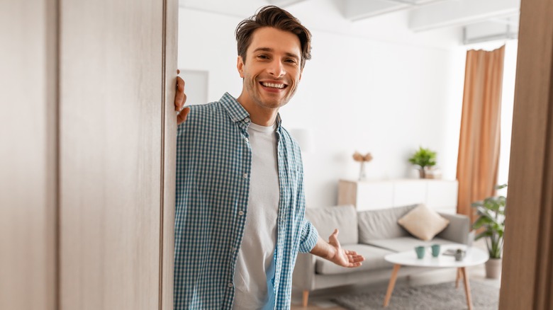 Person welcoming people into home