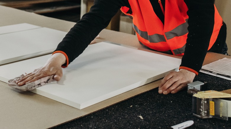 Worker making PVC boards