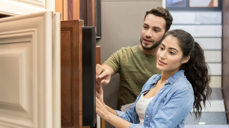 Couple shopping for cabinets