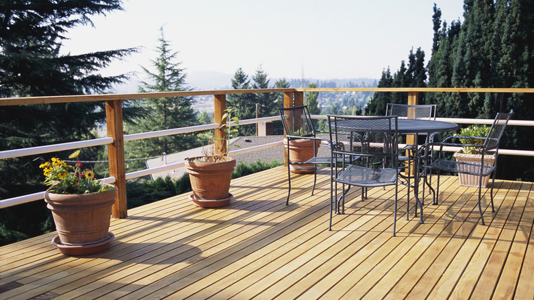 Wood deck with patio chairs and planters