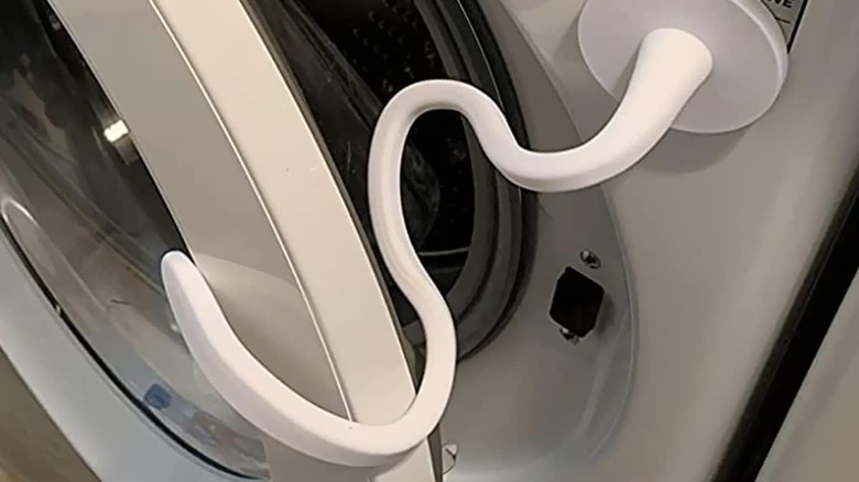 Washing machine door prop