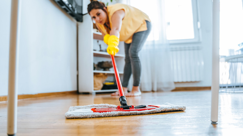 woman mopping wood floors