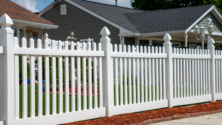 home with white vinyl fence