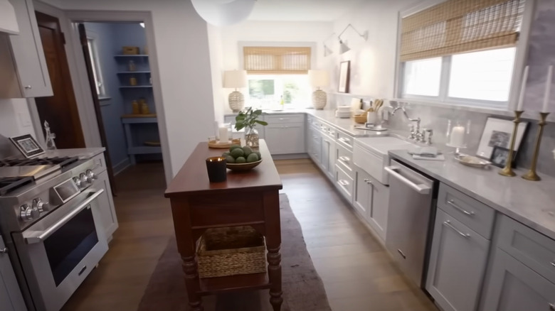 gray kitchen with wooden island