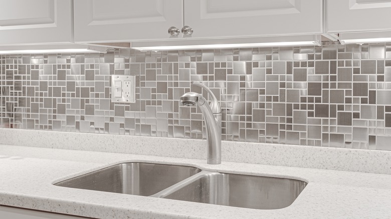 kitchen with stainless steel backsplash