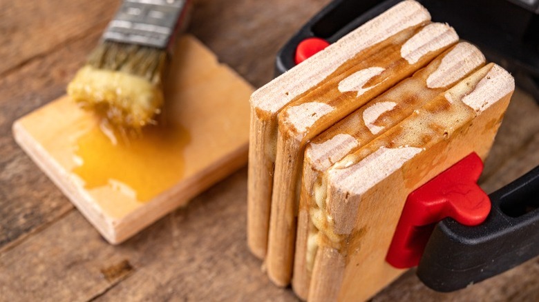 hand clamp holding glued plywood pieces together