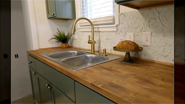 kitchen renovated with marble-y tiles