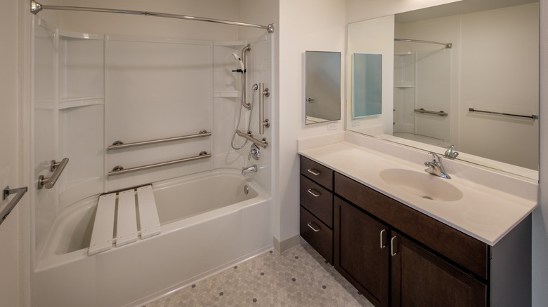 standard grab bar near sink and shower in bathroom